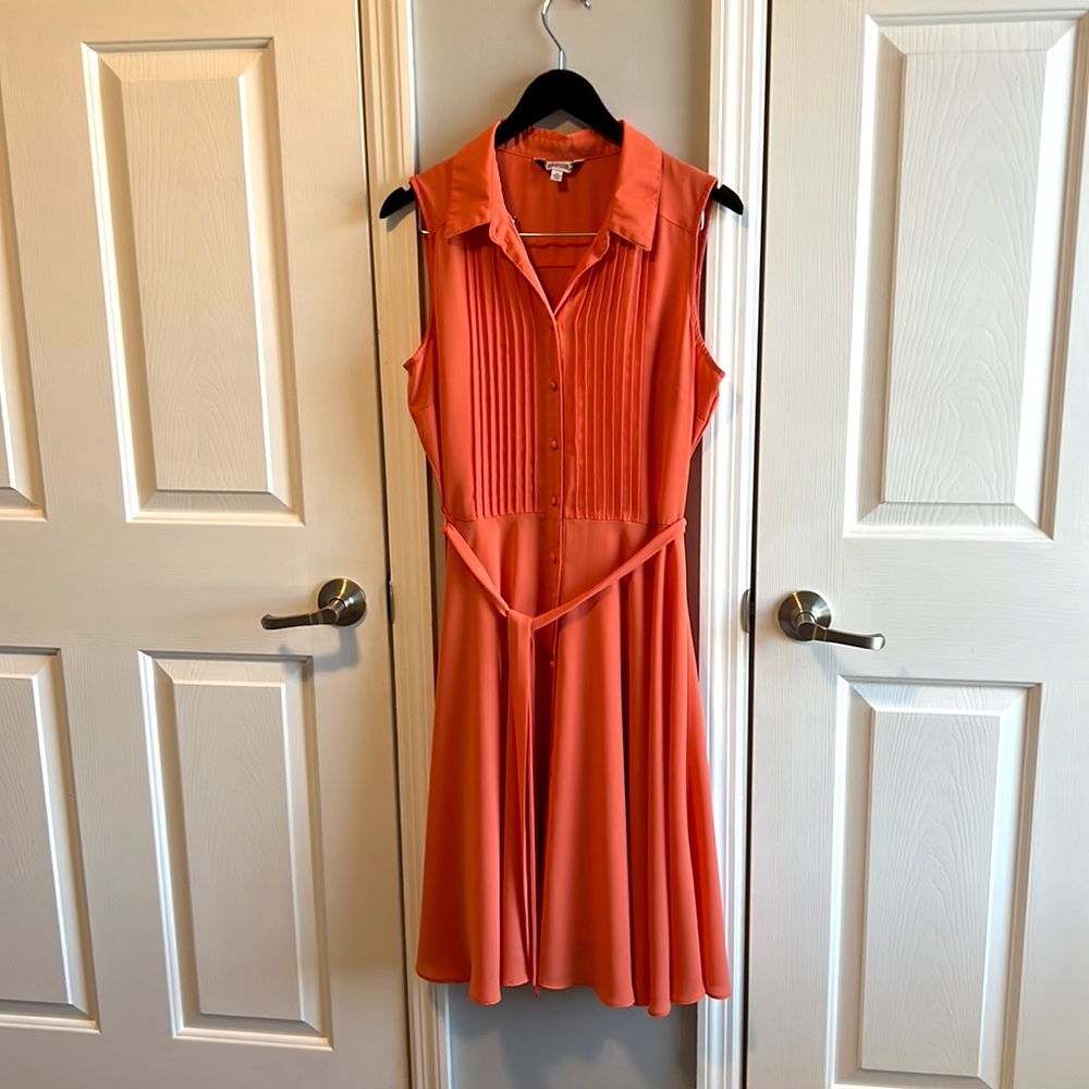 Peach colored, knee length dress